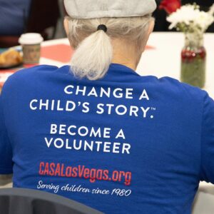Shirt that reads Change a Child's Story. Become a Volunteer