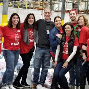 Group of CASA volunteers in red shirts
